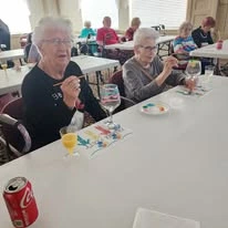 Ascension Living Via Christi Village McLean Senior Living in Wichita, Kansas residents painting