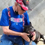 The Oaks Gracious Retirement Living Hawthorn Senior Independent Living in Georgetown, Texas resident petting a dog