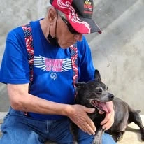 The Oaks Gracious Retirement Living Hawthorn Senior Independent Living in Georgetown, Texas resident petting a dog