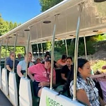 The Arbor at Avamere Court Assisted Senior Living in Keizer, Oregon residents on an open air bus