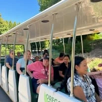 The Arbor at Avamere Court Assisted Senior Living in Keizer, Oregon residents on an open air bus