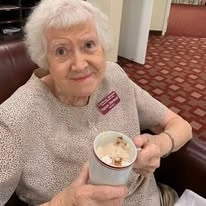 Linwood Estates Gracious Retirement Living Hawthorn Senior Independent Living in Lawrenceville, Georgia resident drinking a cup of coffee