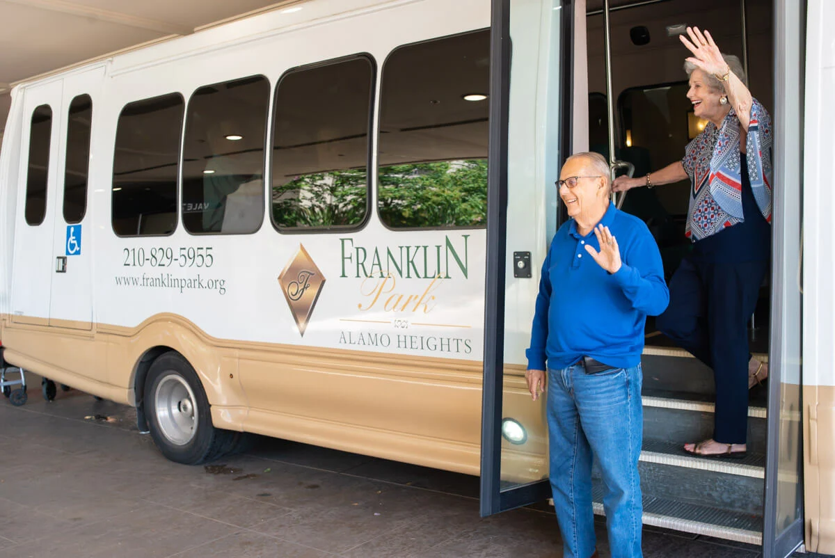 Franklin Park Boerne resident standing in front of the transportation bus