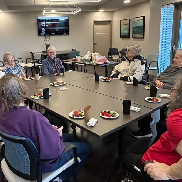 Astral at Auburn, senior living community offering independent living, assisted living, and memory care in Auburn, IN, residents enjoy gathering together