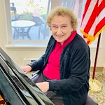 Hessler Heights Gracious Retirement Living Hawthorn Senior Independent Living in Leesburg, Virginia resident playing piano