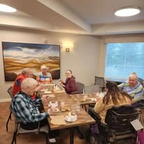 Avamere at St. Helens senior living community offering independent living, assisted living, memory care, and respite care in St. Helens, OR, residents socializing
