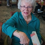Allisonville Meadows Assisted Living offering assisted living, memory care, and respite care in Fishers, IN, resident enjoying some popcorn