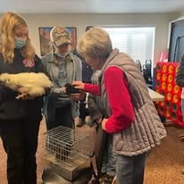 Stone Lodge Gracious Retirement Living Hawthorn Senior independent Living in Bend, Oregon resident petting an animal
