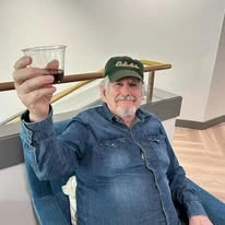 The Oaks At Lebanon Senior Living Community in Lebanon, Oregon resident holding drink
