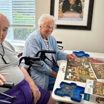 Jordan Oaks Gracious Retirement Living Hawthorn Senior Independent Living in Cary, North Carolina residents solving a puzzle