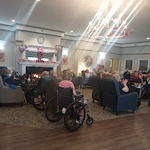 American House Sterling Heights, senior living community offering independent living and respite care in Sterling Heights, MI, residents watching a show