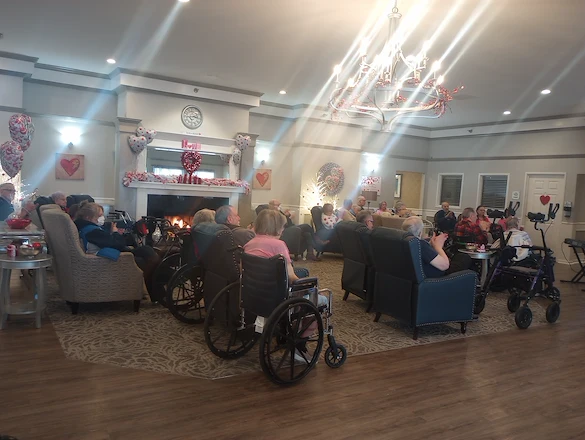 American House Sterling Heights, senior living community offering independent living and respite care in Sterling Heights, MI, residents watching a show