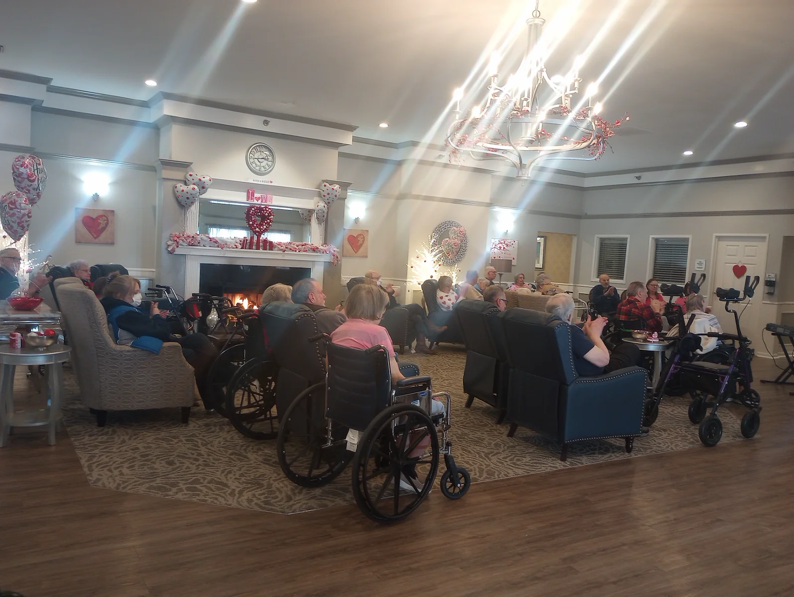 American House Sterling Heights, senior living community offering independent living and respite care in Sterling Heights, MI, residents watching a show