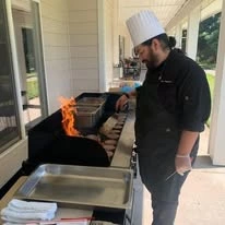 chef grilling at Somerset Lodge Gracious Retirement Living Hawthorn Senior Independent Living in Gladstone, Oregon