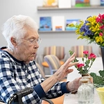 Fieldstone Memory Care of Silverdale resident floral arranging activity