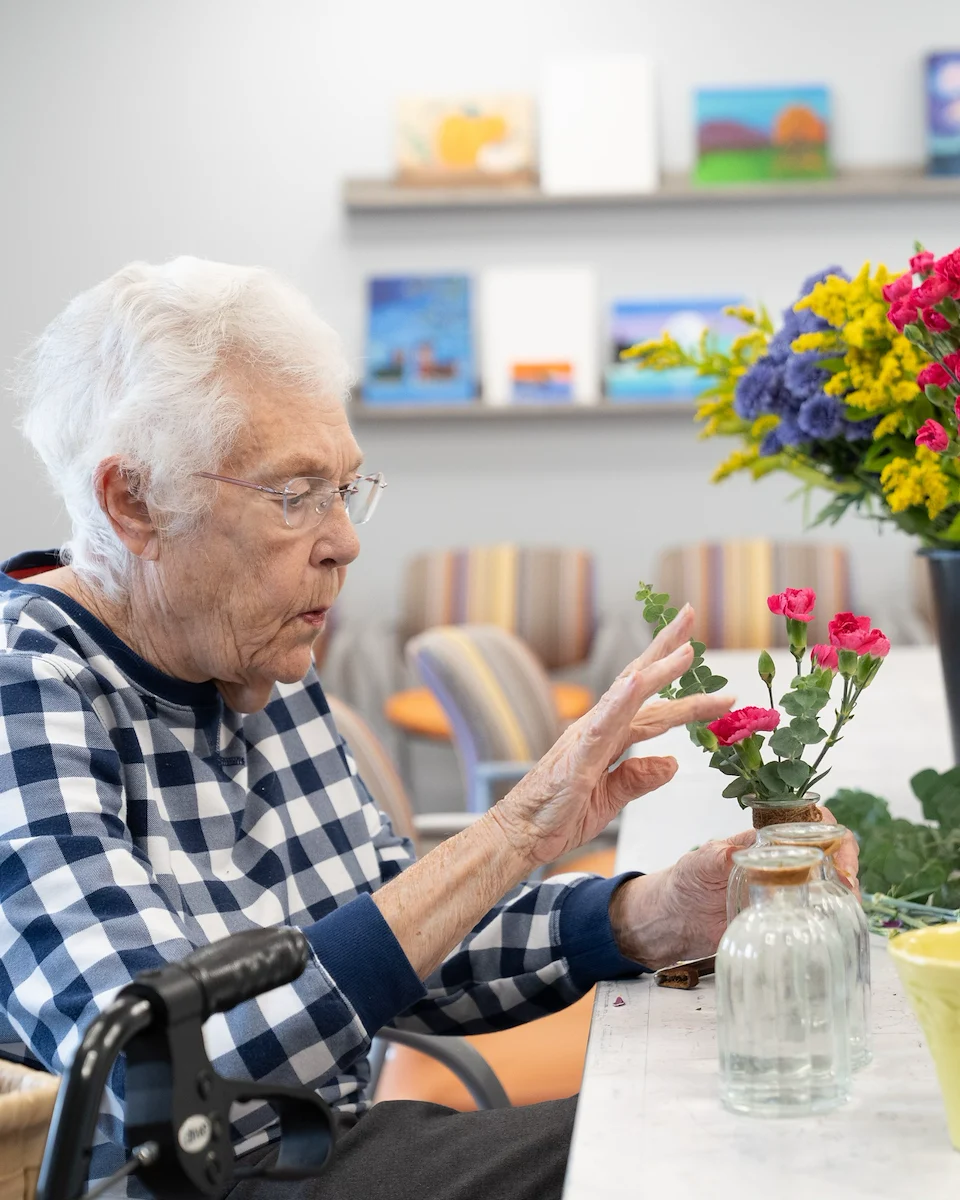 Fieldstone Memory Care of Silverdale resident floral arranging activity