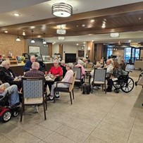 Residents of Broadwell Senior Living at Plymouth participate in their social hour, catching up with old friends and making new ones