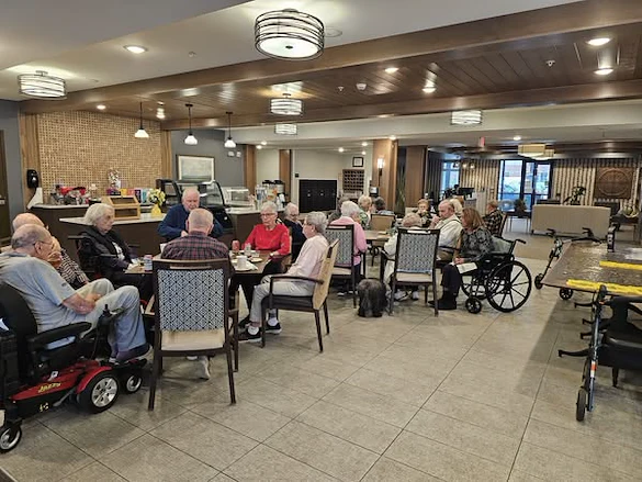 Residents of Broadwell Senior Living at Plymouth participate in their social hour, catching up with old friends and making new ones