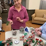 Pioneer Valley Lodge Gracious Retirement Living Hawthorn Senior Independent Living in North Logan, Utah residents doing a Christmas art and craft