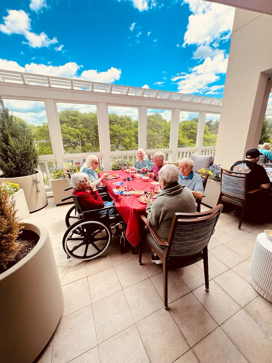 KindCare at Bristol, CT, residents enjoy socializing outside