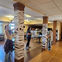 Ascension Living Lakeshore at Siena Memory Care Senior Living in Racine, Wisconsin staff members decorating for Halloween