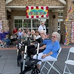 Pioneer Ridge Gracious Retirement Living Hawthorn Senior Independent Living in McKinney, Texas residents at an outdoor party
