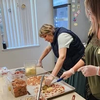 pizza night at Parkrose Chateau Gracious Retirement Living Hawthorn Senior Independent Living in Portland, Oregon