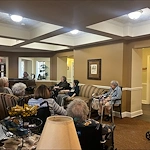 Aberdeen Crossings by New Perspective, senior living community offering assisted living in Highland Heights, OH, residents enjoying entertainment