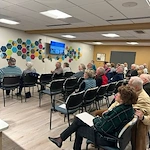 Porter Hills Village residents learning from a presentation