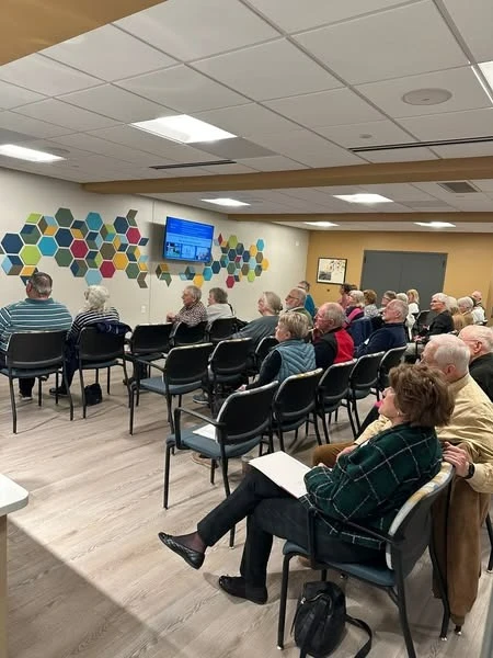 Porter Hills Village residents learning from a presentation