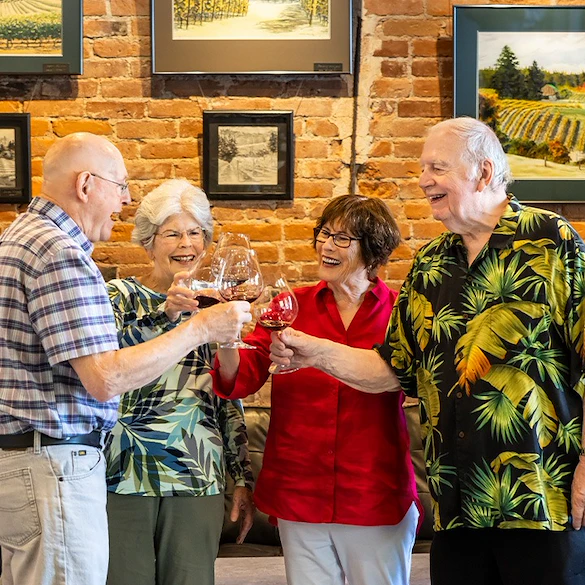 Hillside Senior Living in McMinnville, OR, happy residents enjoying a glass of wine