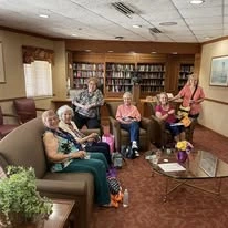 Ascension Casa Scalabrini Senior Living, independent senior living community in Northlake, IL, residents gathered together in the library