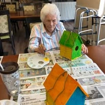 Ascension Living Valley Residence Senior Living in Chattanooga, Tennessee resident painting a birdhouse