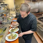 The Stafford Senior Living in Lake Oswego, Oregon chef making food