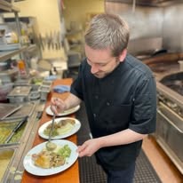The Stafford Senior Living in Lake Oswego, Oregon chef making food
