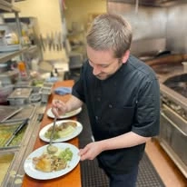 The Stafford Senior Living in Lake Oswego, Oregon chef making food