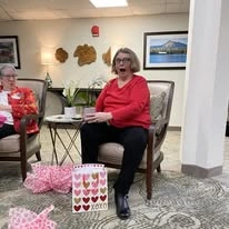 Parkrose Chateau Gracious Retirement Living Hawthorn Senior Independent Living in Portland, Oregon resident opening a Valentine's Day gift