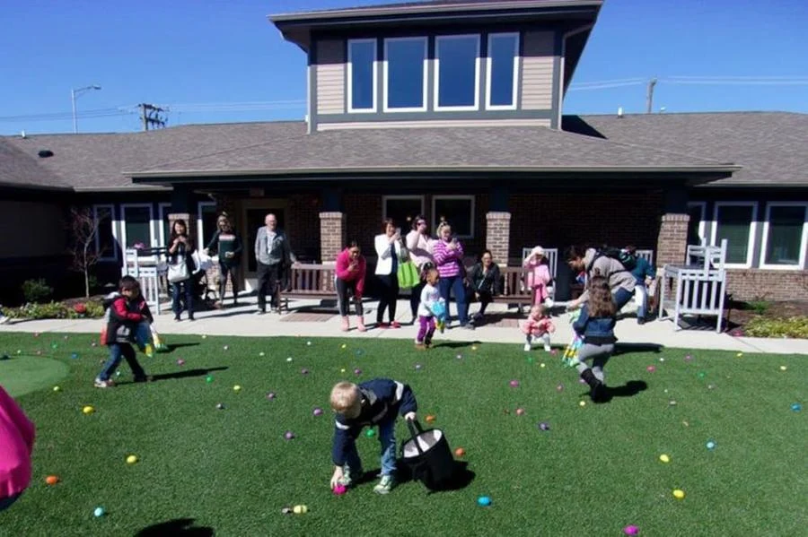 Porter Place Assisted Senior Living Memory Care in Tinley Park, IL residents at an Easter egg hunt