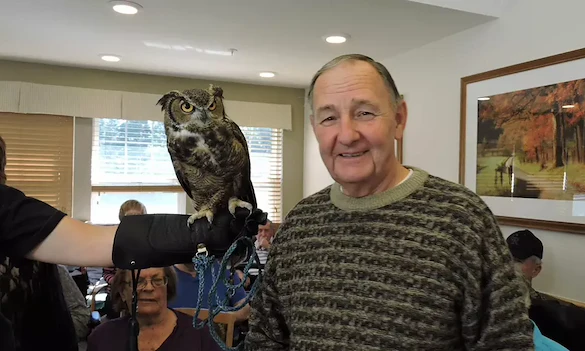 Harvester Place Senior Assisted Living Memory Care in Burr Ridge, IL resident holding an owl