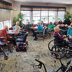 Allisonville Meadows Assisted Living offering assisted living, memory care, and respite care in Fishers, IN, residents in the dining room socializing