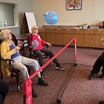 American House Elmwood, senior living community offering independent living, assisted living, memory care, and respite care in Rochester Hills, MI, residents playing a game and staying active