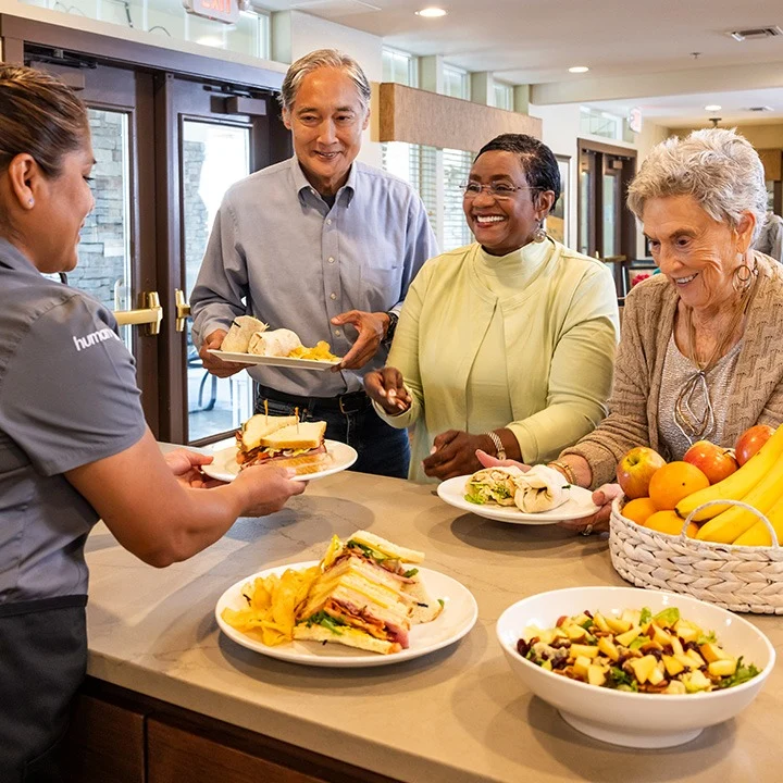 Hillside Senior Living in McMinnville, OR, residents being served wonderful food