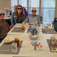 Charter Senior Living of Gallatin, Tennessee, happy residents enjoying dining together