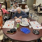 American House Stone senior living community offering independent living and respite care in Rochester Hills, MI, residents playing a game