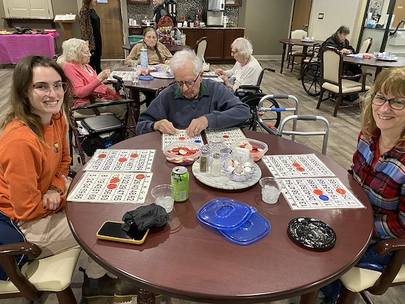 American House Stone senior living community offering independent living and respite care in Rochester Hills, MI, residents playing a game