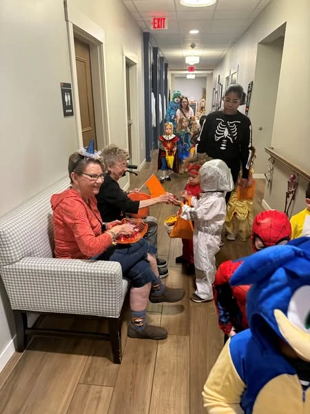 Kids from the local daycare made a surprise visit to the Waters of Oak Creek to do some trick-or-treating