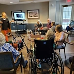 Charter Senior Living of Fredericksburg, Virginia, residents learning from a presentation
