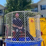 Parker Place Gracious Retirement Living Hawthorn Senior Independent Living in Mentor, Ohio staff member in the dunk tank