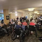 Oak Park Senior Living by Cogir in Roseburg, Oregon residents watching a show