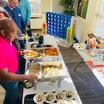Azalea Estates Gracious Retirement Living Hawthorn Senior Independent Living in Chapel Hill, North Carolina residents getting food at a party